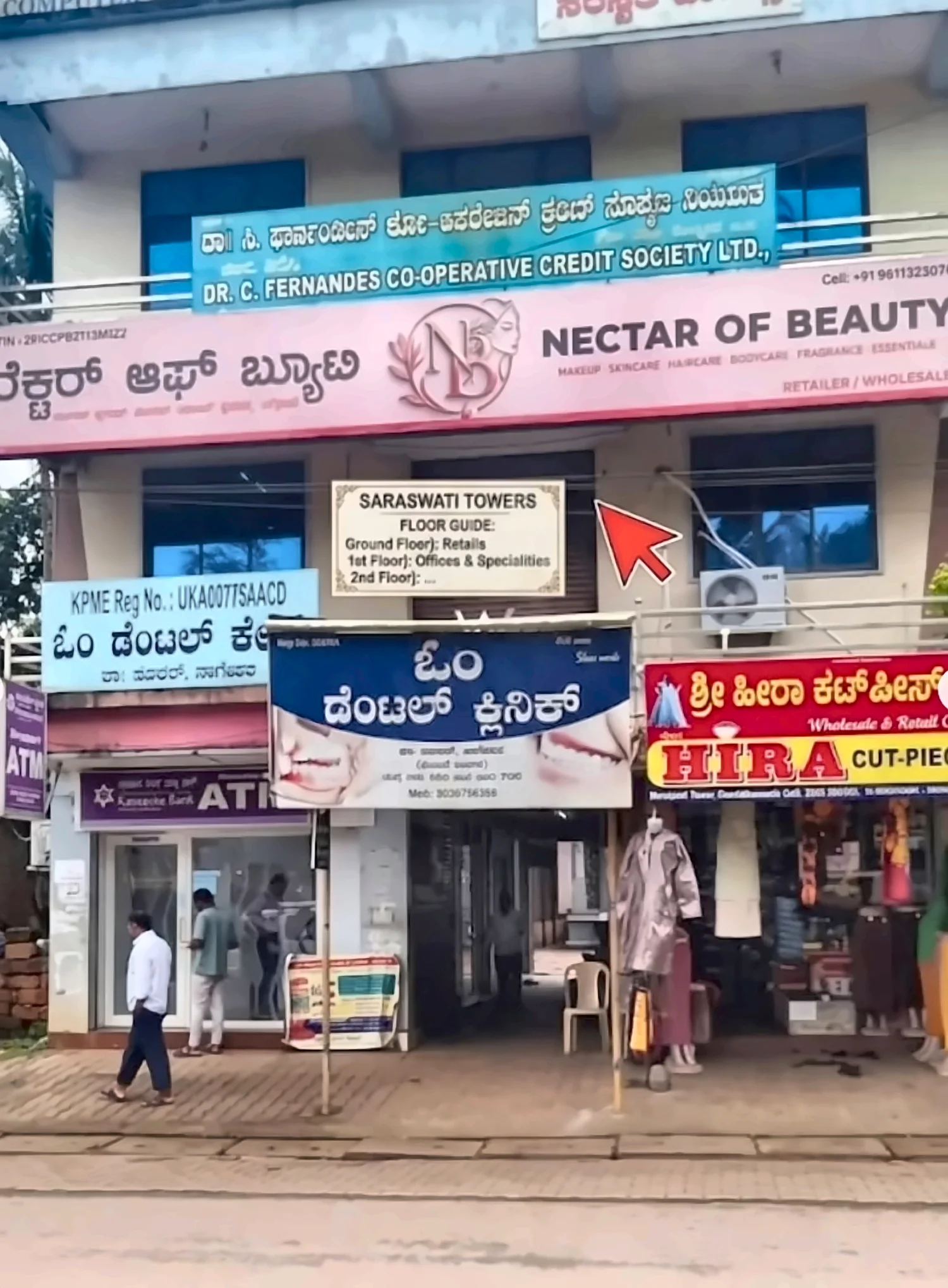 Saraswati Towers in Sirsi with the pink Nectar of Beauty signboard